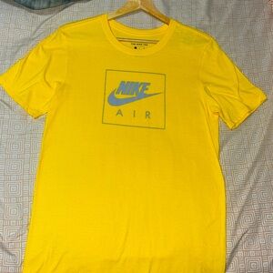 Never been worn. Sat in my closet for the last 3-4 years. Yellow nike tee size s